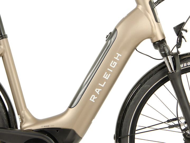 Raleigh Motus Tour Champagne Electric Hybrid Bike - Raleigh - Les's Cycles